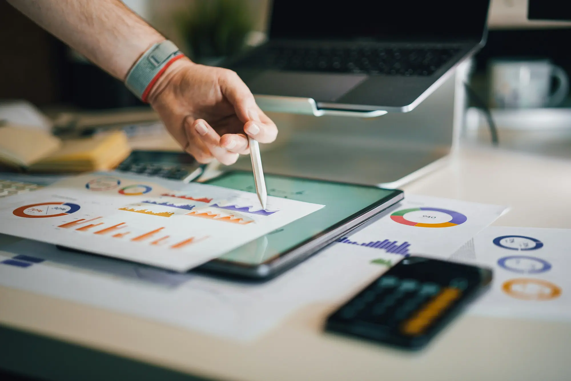 Image of search engine optimization specialist pointing at charts